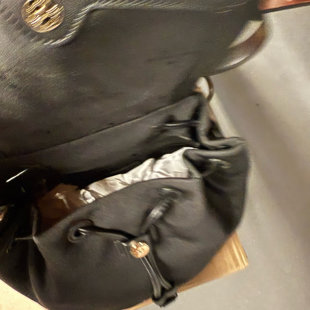 Kate Spade Black Drawstring Backpack with Gold Accents and Minnie Bow